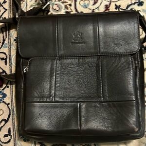 never used unisex leather bag
